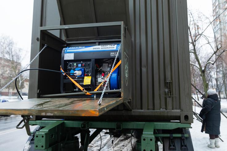Power generator operating in a mobile container unit to provide backup power during outages, Kyiv, Ukraine, January 2026