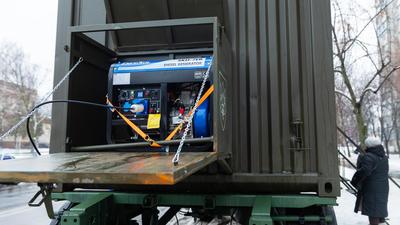 Power generator operating in a mobile container unit to provide backup power during outages, Kyiv, Ukraine, January 2026