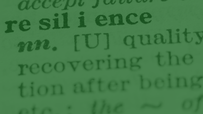 Dictionary close-up of the word "resilience," with pronunciation and part of speech.