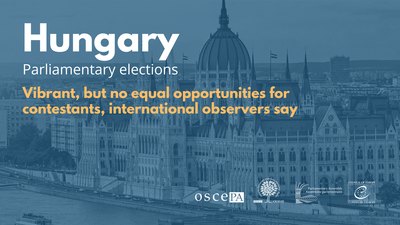 Blue-toned graphic of Budapest Parliament with election text overlay.